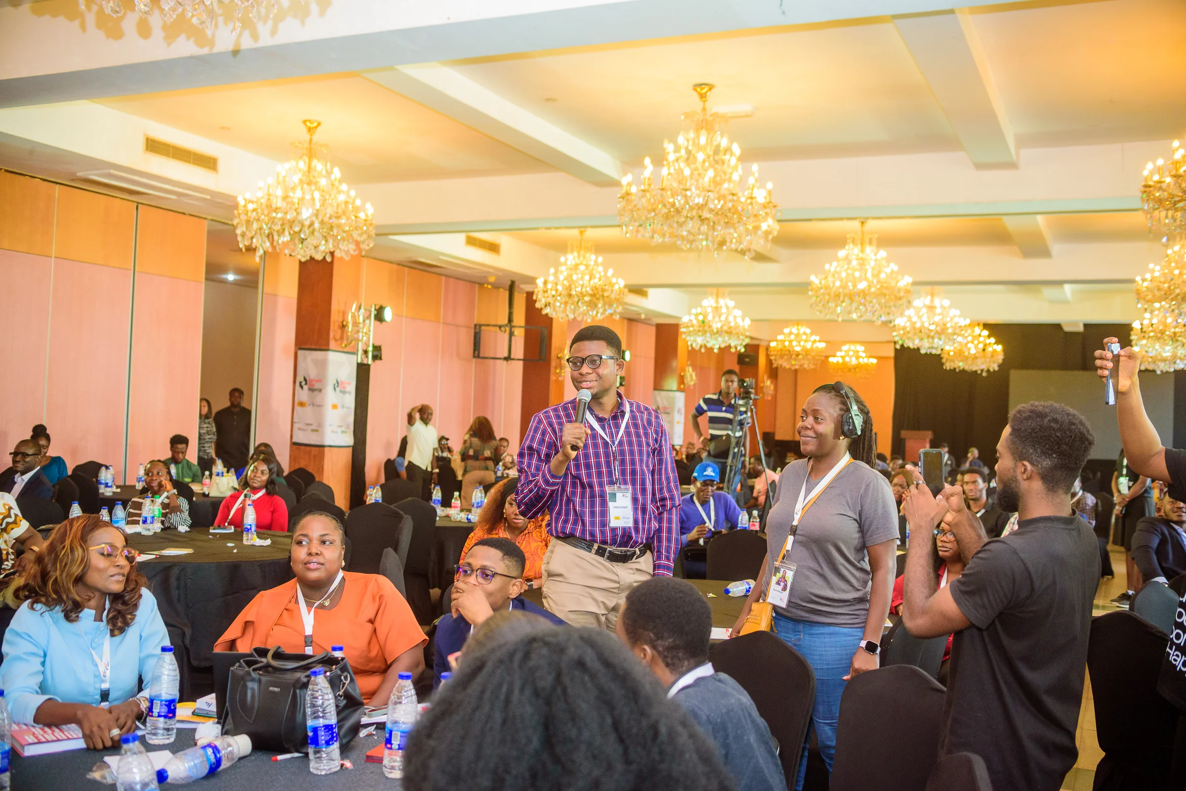 An attendee asking a question from the floor during a Scrum Day Nigeria session